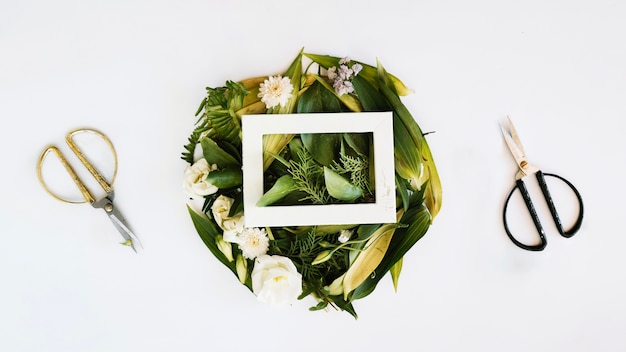 Free photo floral composition, frame and scissors