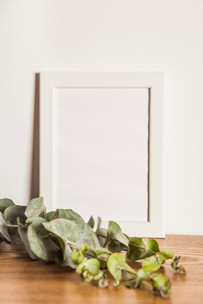 Floral composition with frame and leaves