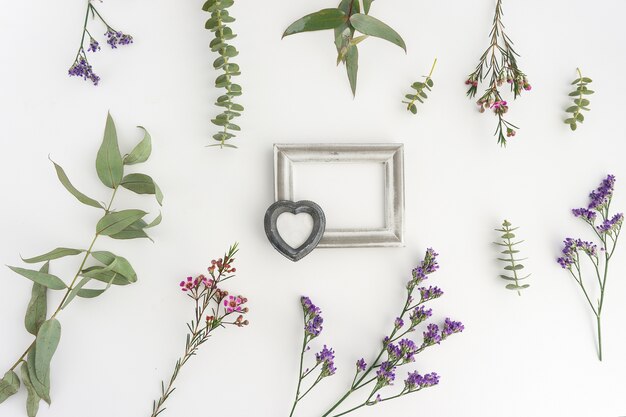 Floral composition with silver frame and heart