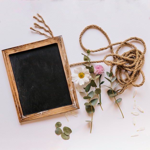 Free photo floral composition with slate