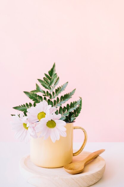 Floral composition with wooden spoon