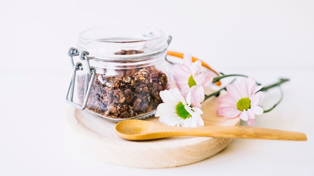 Floral decoration with nuts on wooden plate