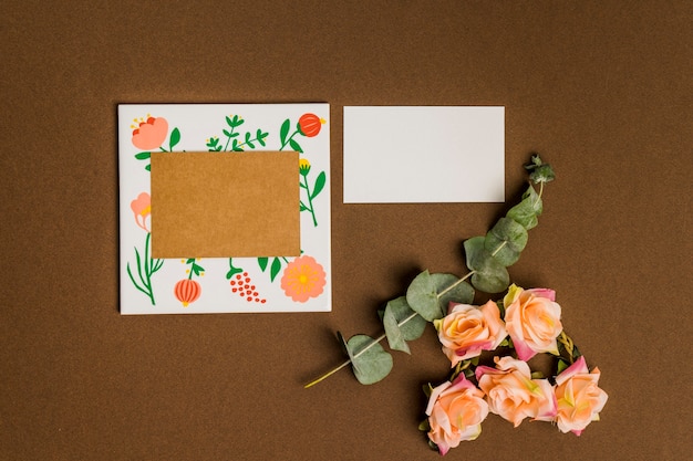 Free photo floral decoration with sheets of paper and cardboard