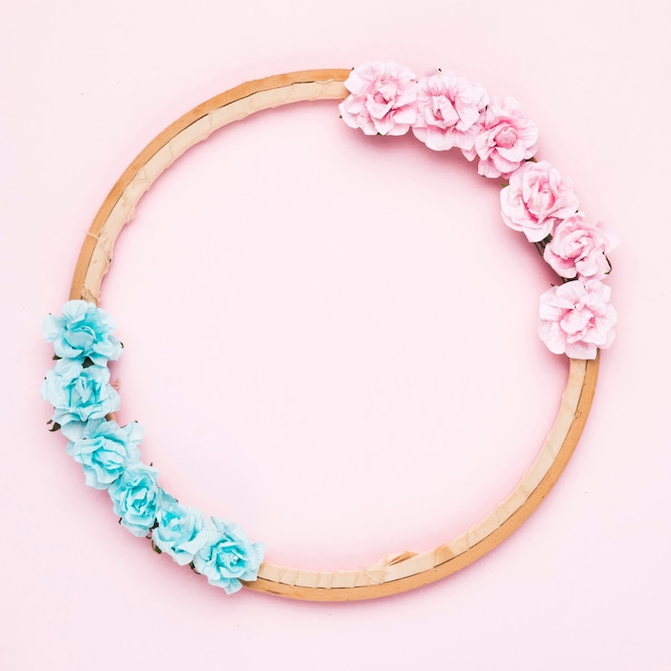Free Photo floral wooden frame on pink background