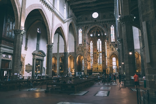 Florence, italy - june 24, 2018: panoramic view of interior of basilica di santa croce (basilica of the holy cross) is franciscan church in florence and minor basilica of roman catholic church