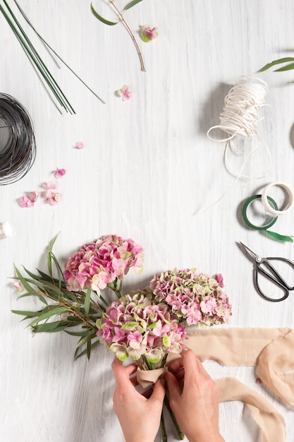 florist desktop with working tools and ribbons