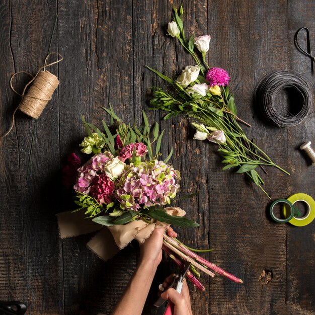 florist desktop with working tools and ribbons