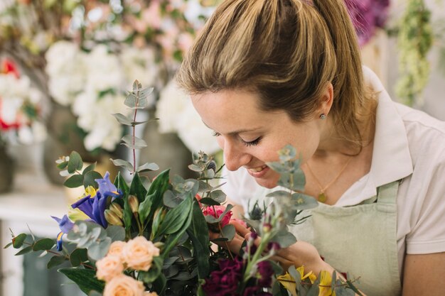 Florist looking at bouquet