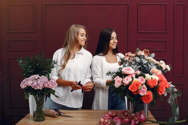 Florist makes a beautiful bouquet in a studio