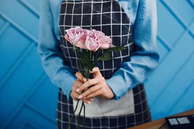 Florist makes a beautiful bouquet in a studio