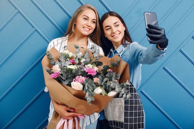 Florist makes a beautiful bouquet in a studio