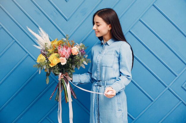 Florist makes a beautiful bouquet in a studio