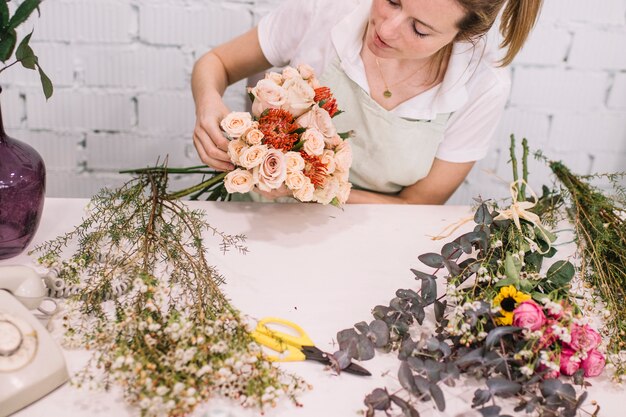 Florist making cute bouquet