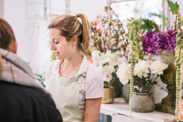 Florist talking with client