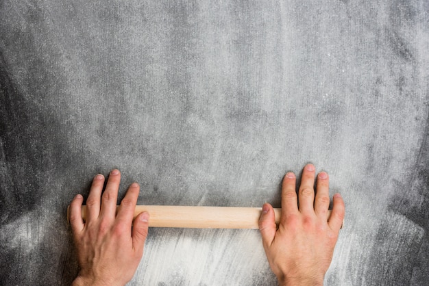 Flour background with rolling pin