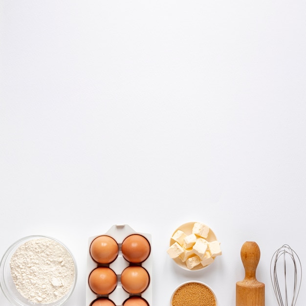 Flour eggs sugar and a kitchen roller