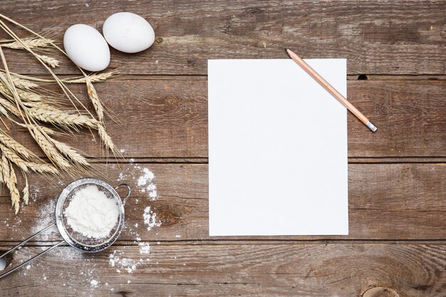 The flour  and eggs on an wooden 