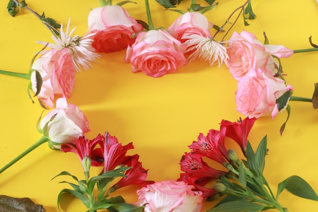 Free photo flower arrangement with cute writing on a heart