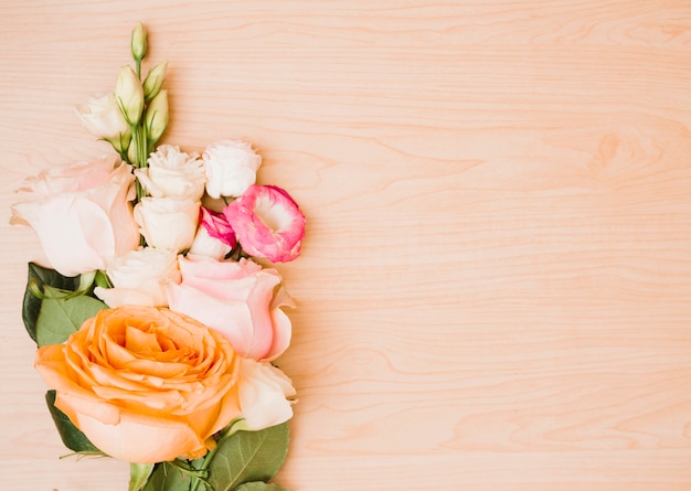 Flower bouquet on wooden background