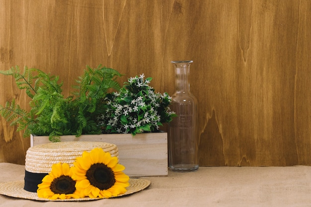 Flower composition with plants and hat