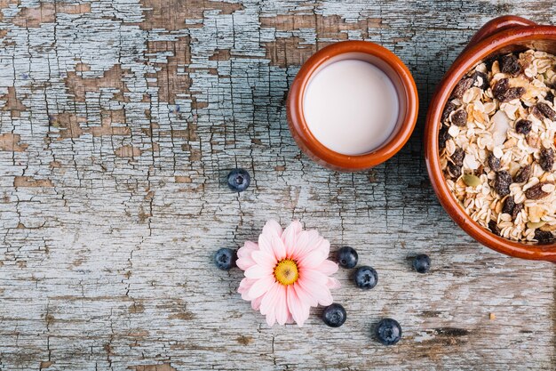 Flower near milk and muesli