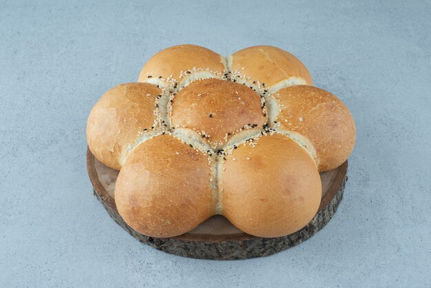 Flower shaped bread on wooden board