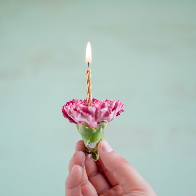 Flower with lit candle