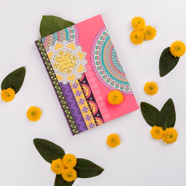 Flowers around notebook