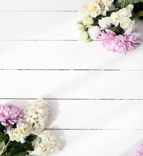 Flowers bouquet on wooden background