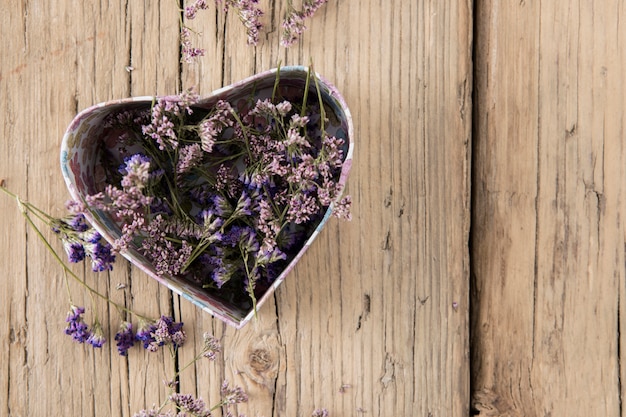 Free photo flowers in box in heart shape