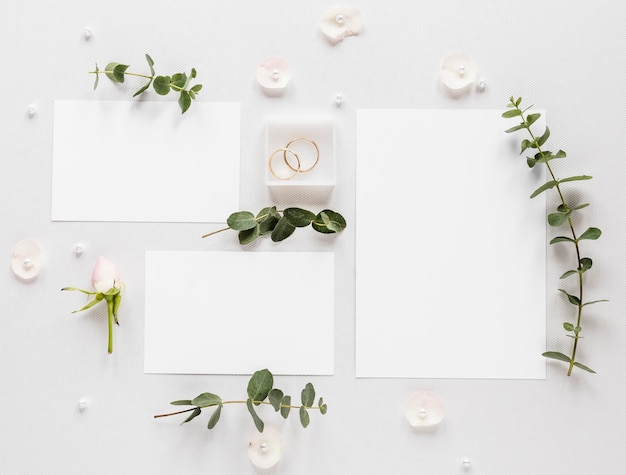 Flowers branches with wedding invitation