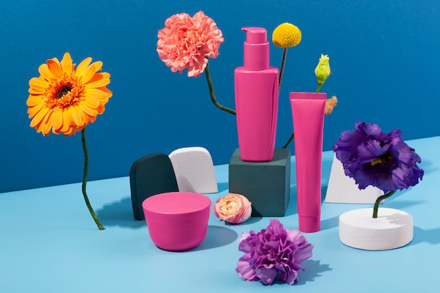 Free photo flowers and cosmetics containers arrangement