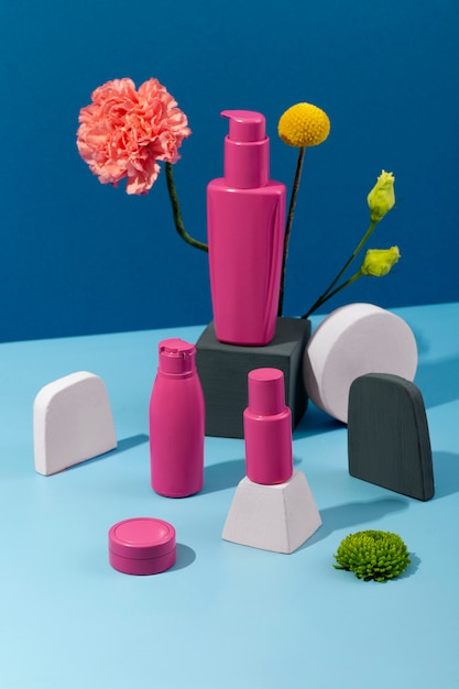 Flowers and cosmetics containers high angle