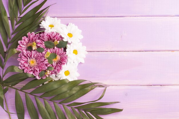 Flowers decoration on purple plank backdrop