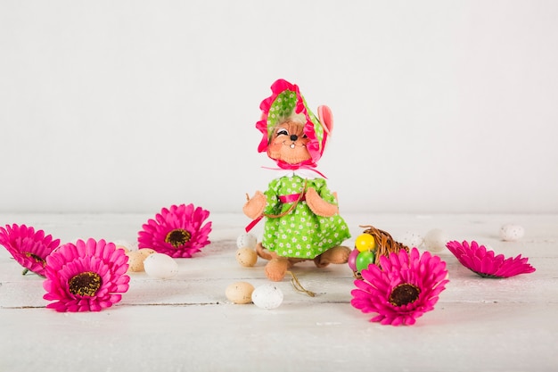 Flowers and eggs near Easter statuette