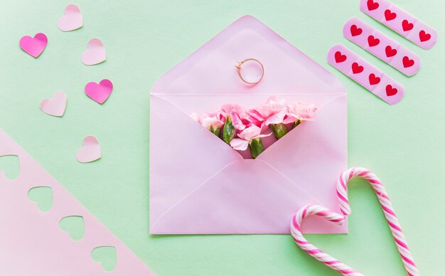 Flowers in envelope with wedding ring 