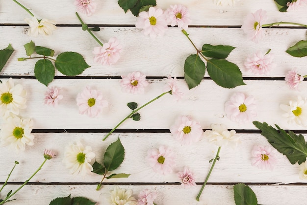 Flowers and leaves on lumber tabletop