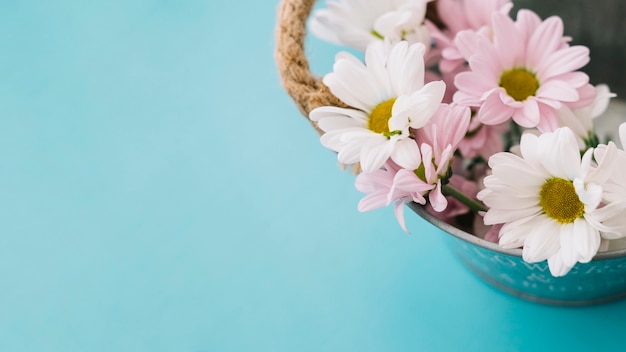 Flowers in metal bucket