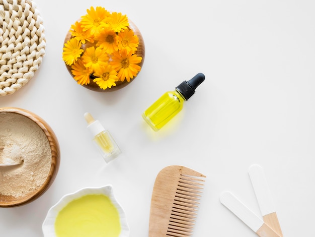 Free photo flowers and oils spa treatment arrangement cosmetics