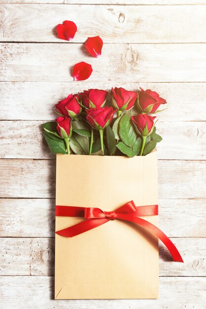 Flowers in paper envelope with petals around