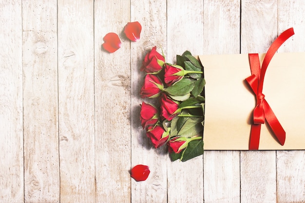 Flowers in paper envelope with petals around