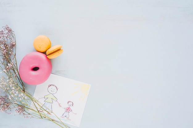 Flowers and pastry near picture