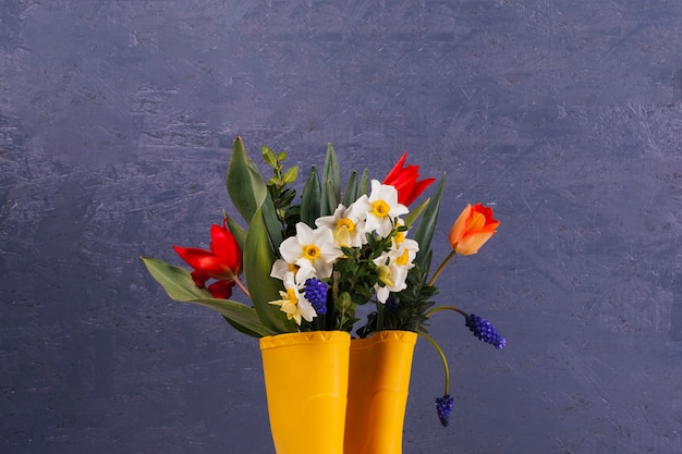 Free photo flowers in some yellow boots