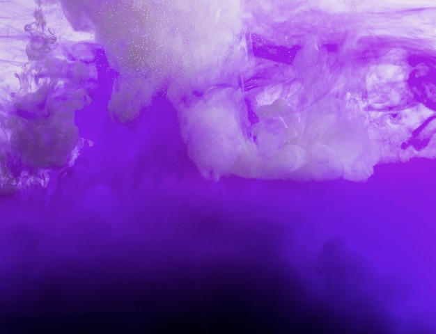 Free photo flowing purple cloud of ink
