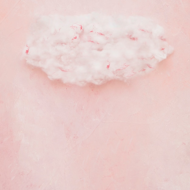 Free photo fluffy cloud on painted textured