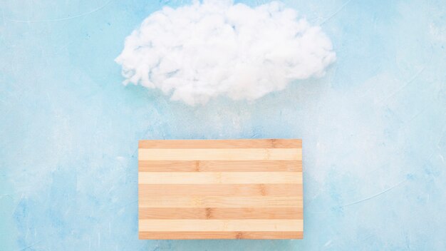 Fluffy cloud over the wooden table