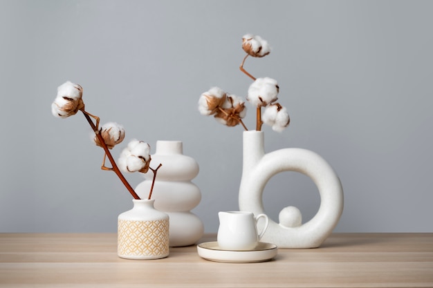 Fluffy cotton plant in vase used in interior decor