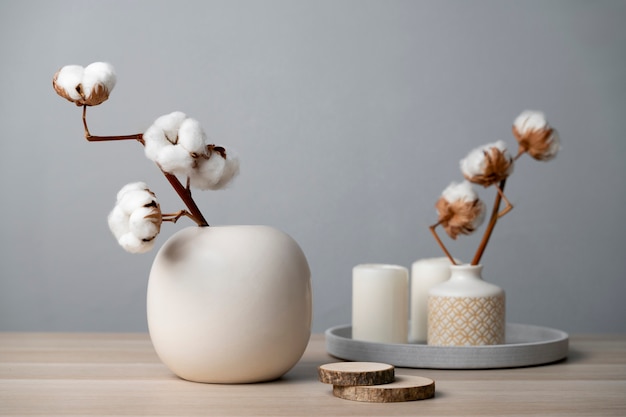 Free photo fluffy cotton plant in vase used in interior decor