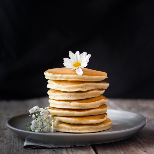 Fluffy pancakes tower on plate