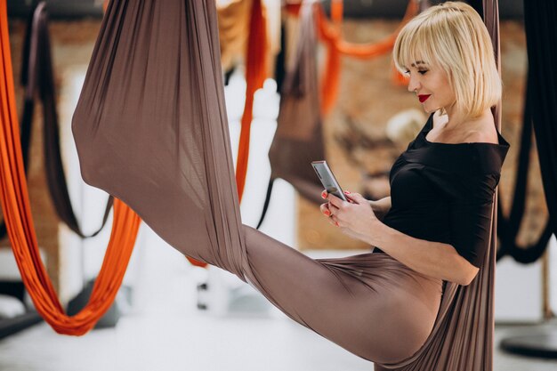 Fly yoga female instructor at the gym